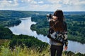 Tourist girl watches the Klyazma river landscape Royalty Free Stock Photo